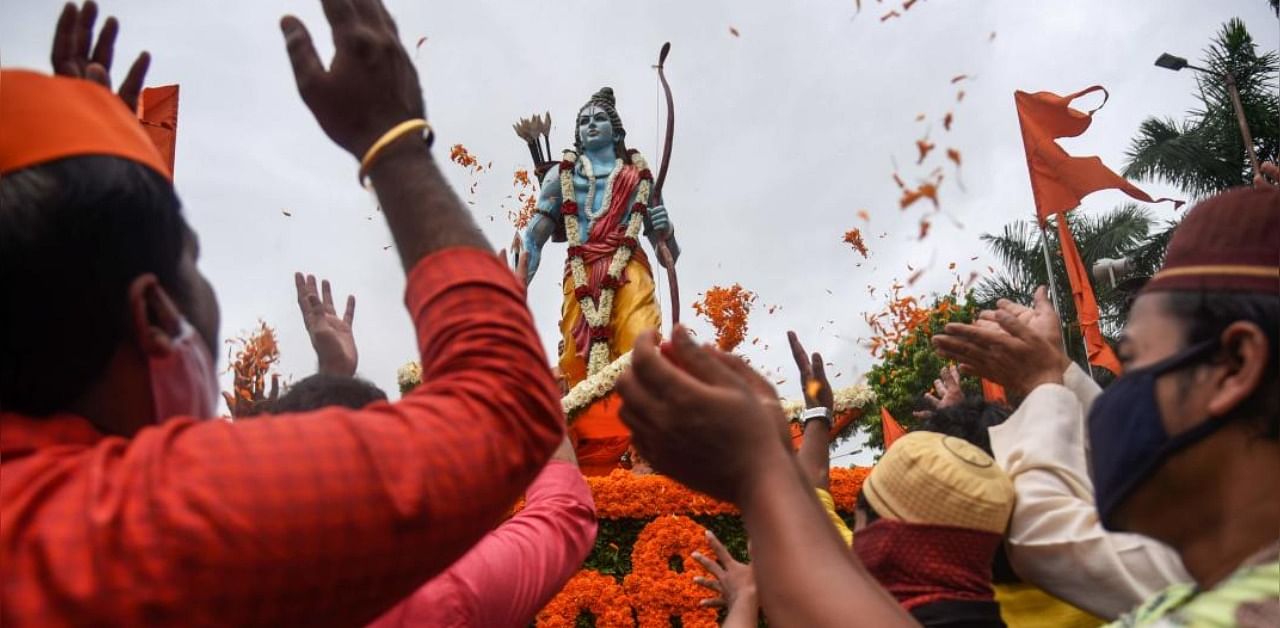 People from the Hindu and Muslim communities celebrate around a 7-feet tall statue of Lord Ram after the foundation stone of a Lord Ram temple in Ayodhya was laid. (PTI)