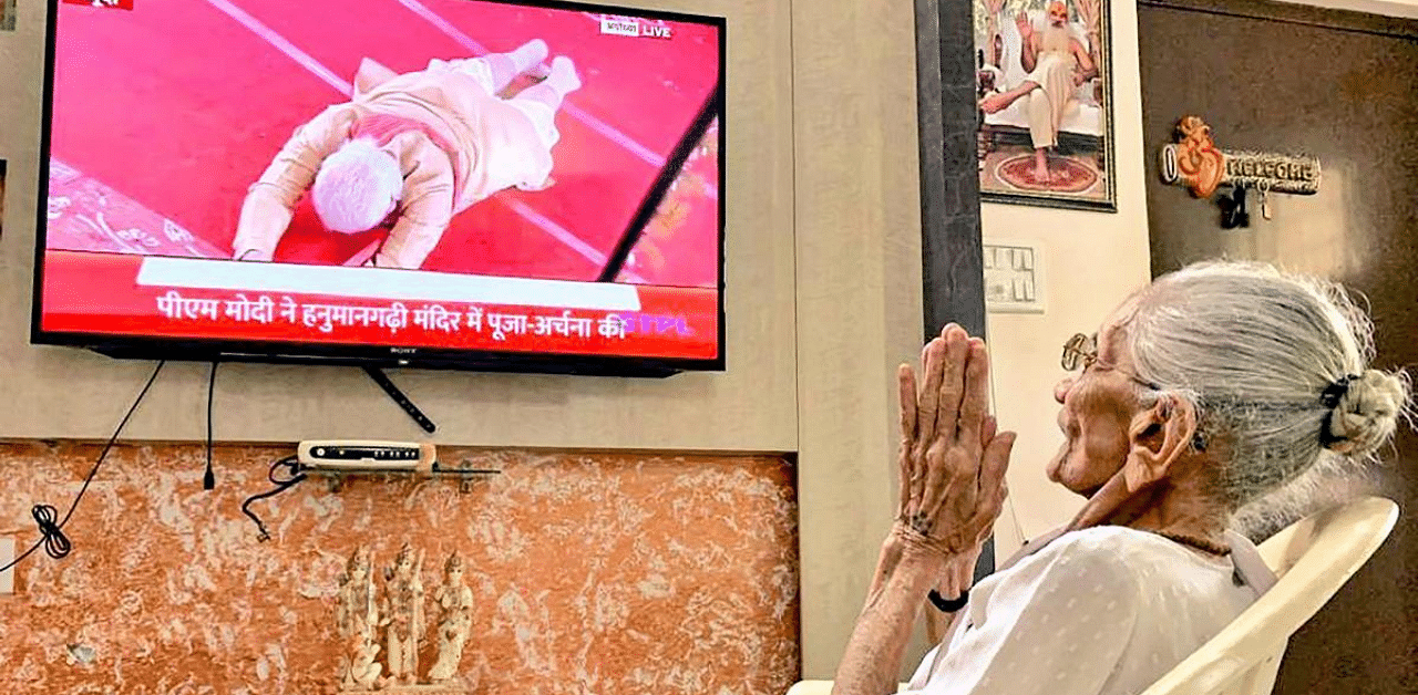 Prime Minister Narendra Modi's mother Hiraben watches the live telecast of the foundation laying ceremony of Ayodhya's Ram Mandir. Credit: PTI Photo