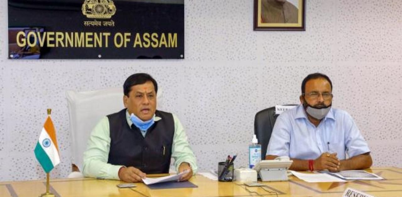 Assam Chief Minister Sarbananda Sonowal (Left) during a meeting. Credit: PTI Photo