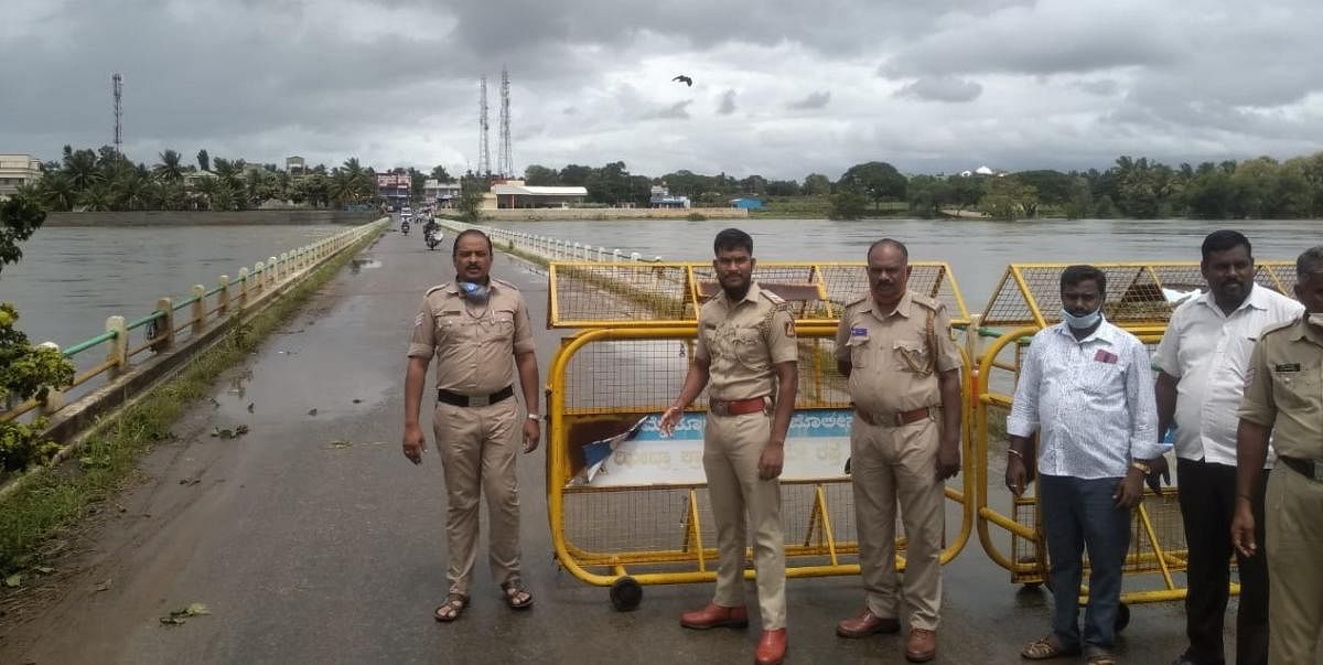Police erect barricades on a bridge near Varuna on Thursday. 
