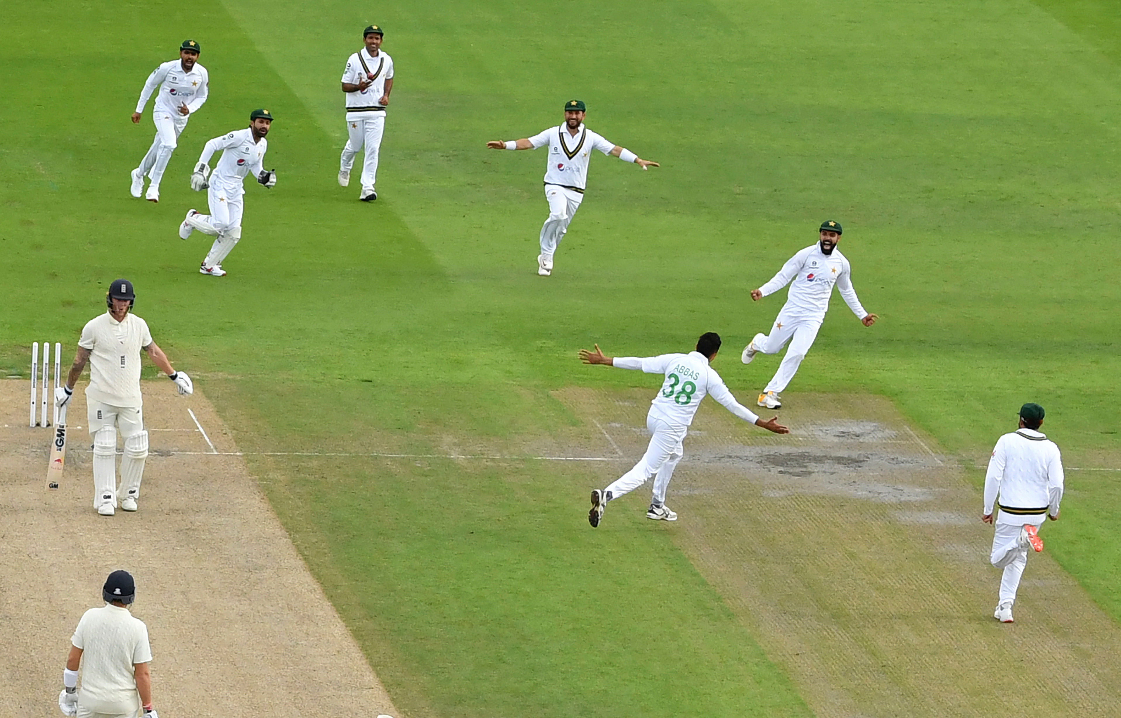 Pakistan's Mohammad Abbas, third right, and teammates celebrate the dismissal of England's Ben Stokes, left, during the second day of the first cricket Test match between England and Pakistan at Old Trafford in Manchester, England, Thursday, Aug. 6, 2020. Credit: AP/PTI Photo