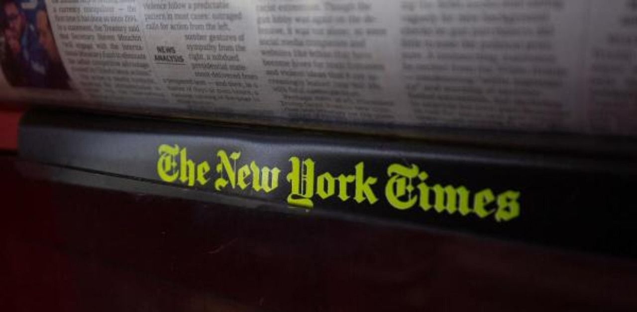 The New York Times logo is seen on a newspaper rack. Credit: AFP