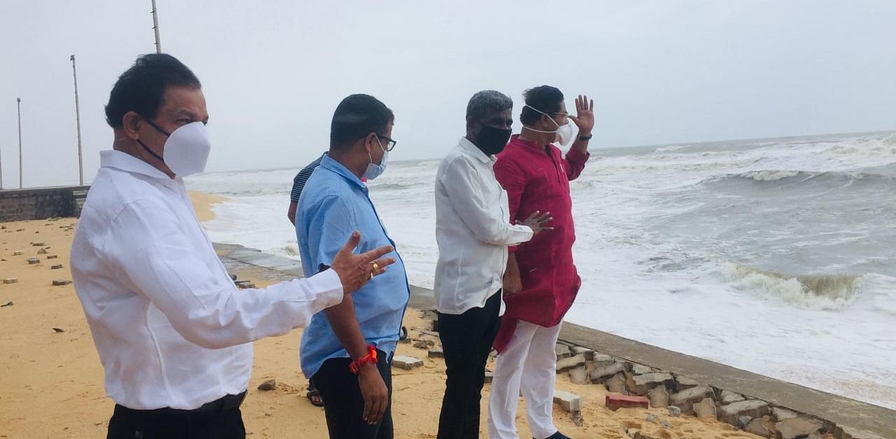 Revenue Minister R Ashoka takes stock of situation in Udupi's Padubidri beach. Credit: DH Photo
