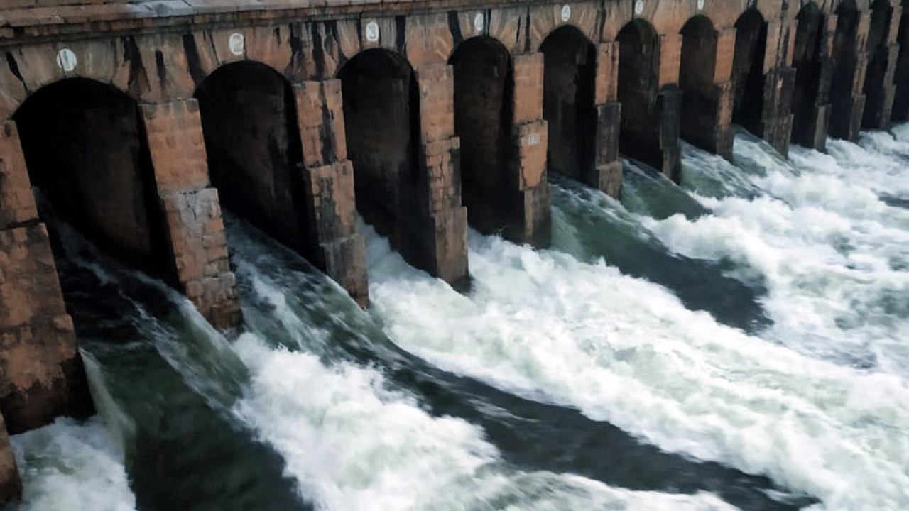 Water being released into the river through the crest gates of KRS dam, in Srirangapatna taluk, Mandya district, on Friday. Credits: DH Photo