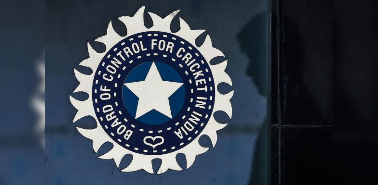 a member of staff walks past the logo of the Board of Control for Cricket in India (BCCI) outside its headquarters in Mumbai. Credit: AFP Photo