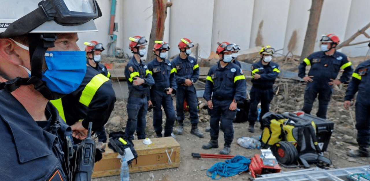 Rescue workers in the devastated Beirut port. Credit: AFP