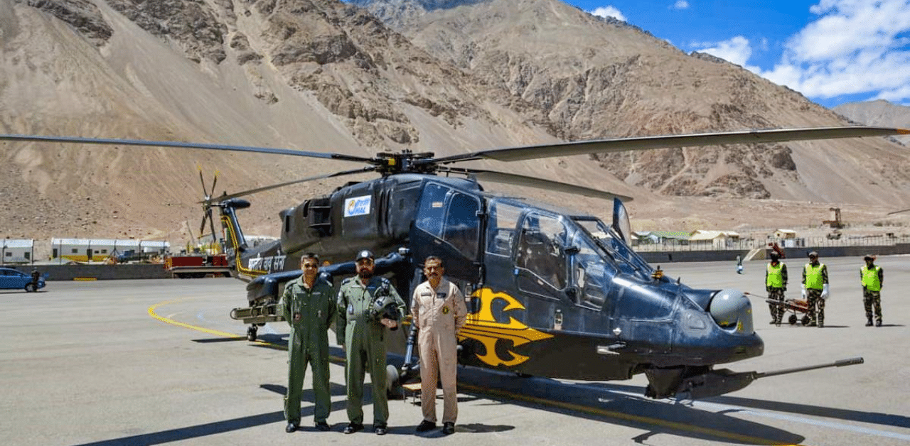Vice Chief of Air Staff, Air Marshal Harjit Singh Arora along with the crew of Light Combat Helicopter during his visit to forward bases in Ladakh region. Credit: PTI Photo