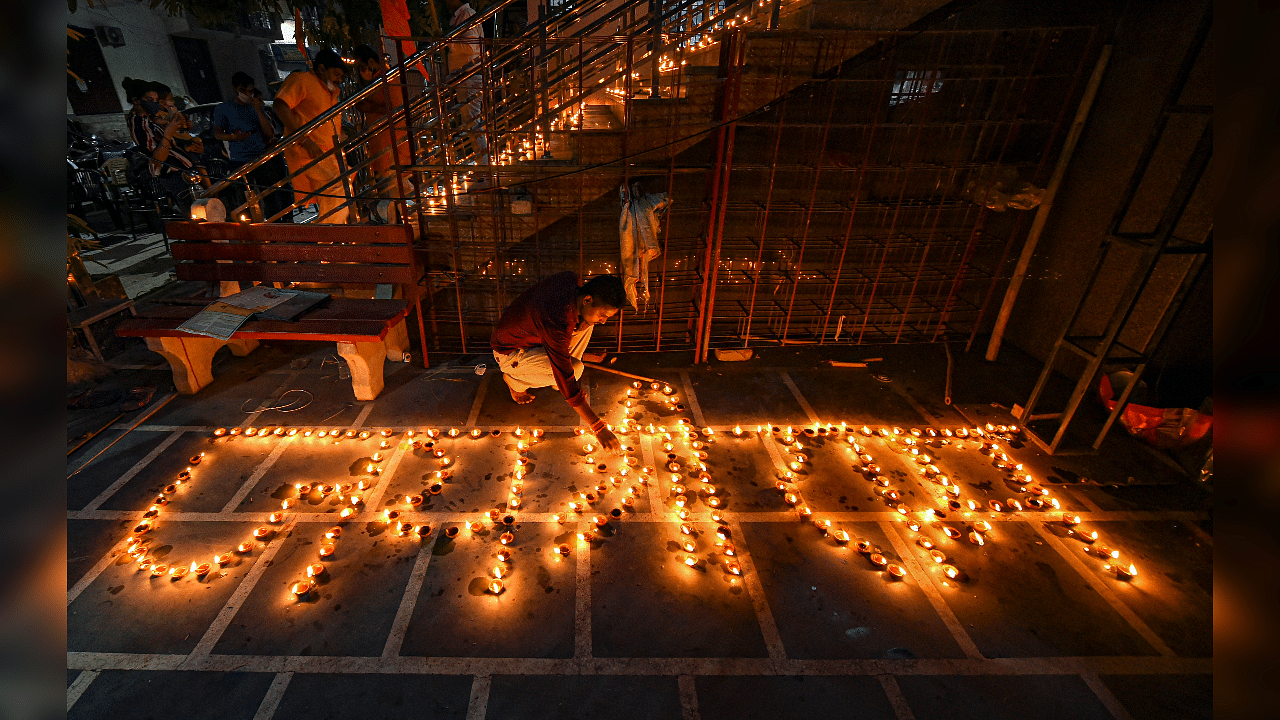 People light earthen lamps at a temple to celebrate the groundbreaking ceremony of the Ayodhya's Ram Temple. Credits: PTI Photo
