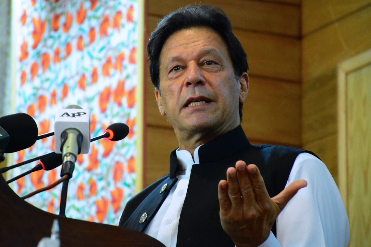 Pakistan's Prime Minister Imran Khan addresses the legislative assembly in Muzaffarabad, the capital of Pakistan-controlled Kashmir on August 5, 2020, to mark the one-year anniversary after New Delhi imposed direct rule on Indian-administered Kashmir. - P