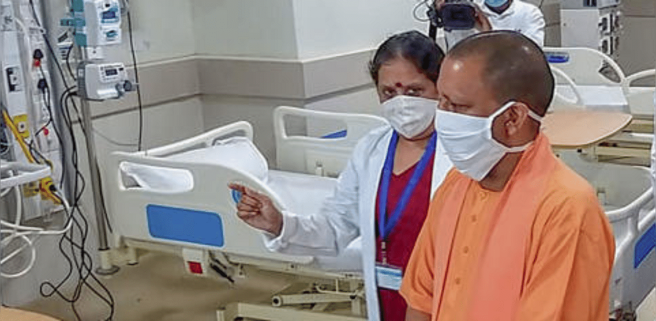 UP CM Yogi Adityanath inspects Noida Covid-19 Hospital after its inauguration, in Noida. Credit: PTI Photo