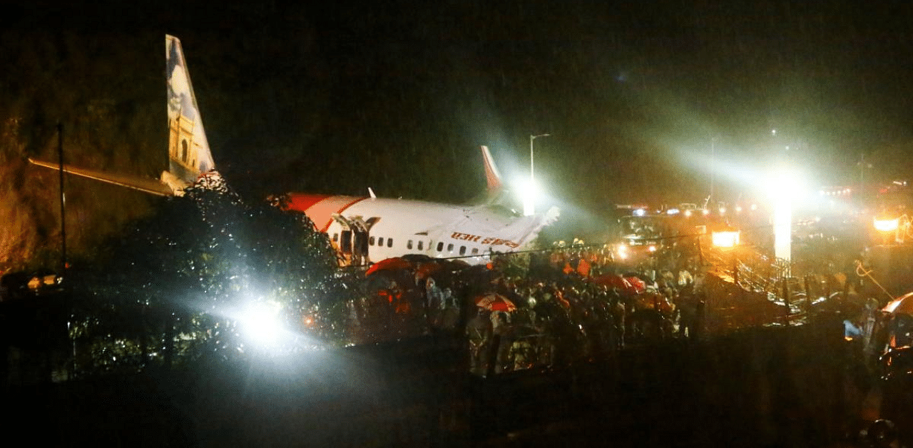 An Air India Express flight with 191 passengers and crew skidded off the tabletop runway in the evening and fell into a 50-foot deep valley while landing. Credit: AFP photo