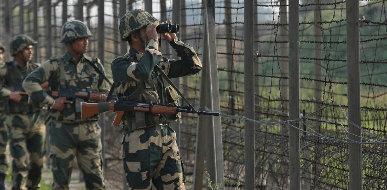 India's Border Security Force (BSF) soldiers patrol along the fenced border with Pakistan. Credit: Reuters (File Photo)