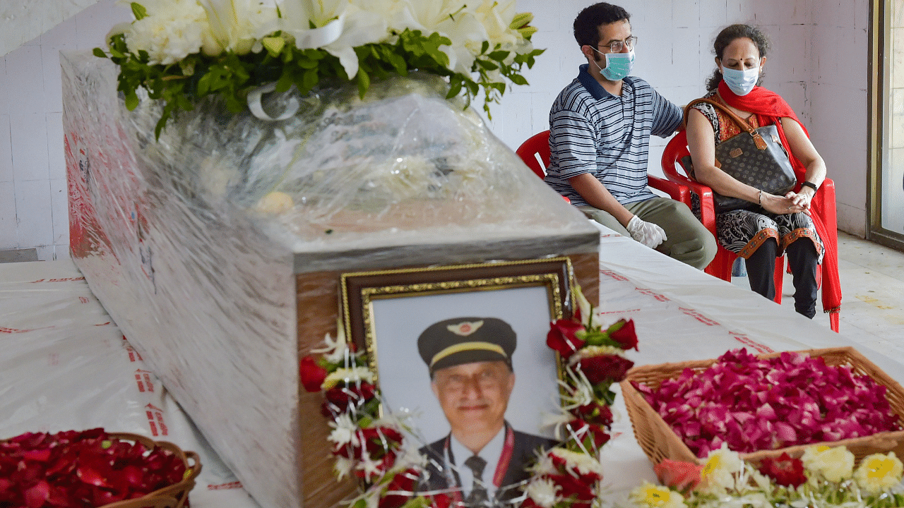  Wife Sushma Sathe and younger son Dhananjay Sathe of Air India Express pilot Captain Deepak Sathe, who died during a crash at Kozhikode International Airport on Friday night. Credits: PTI Photo