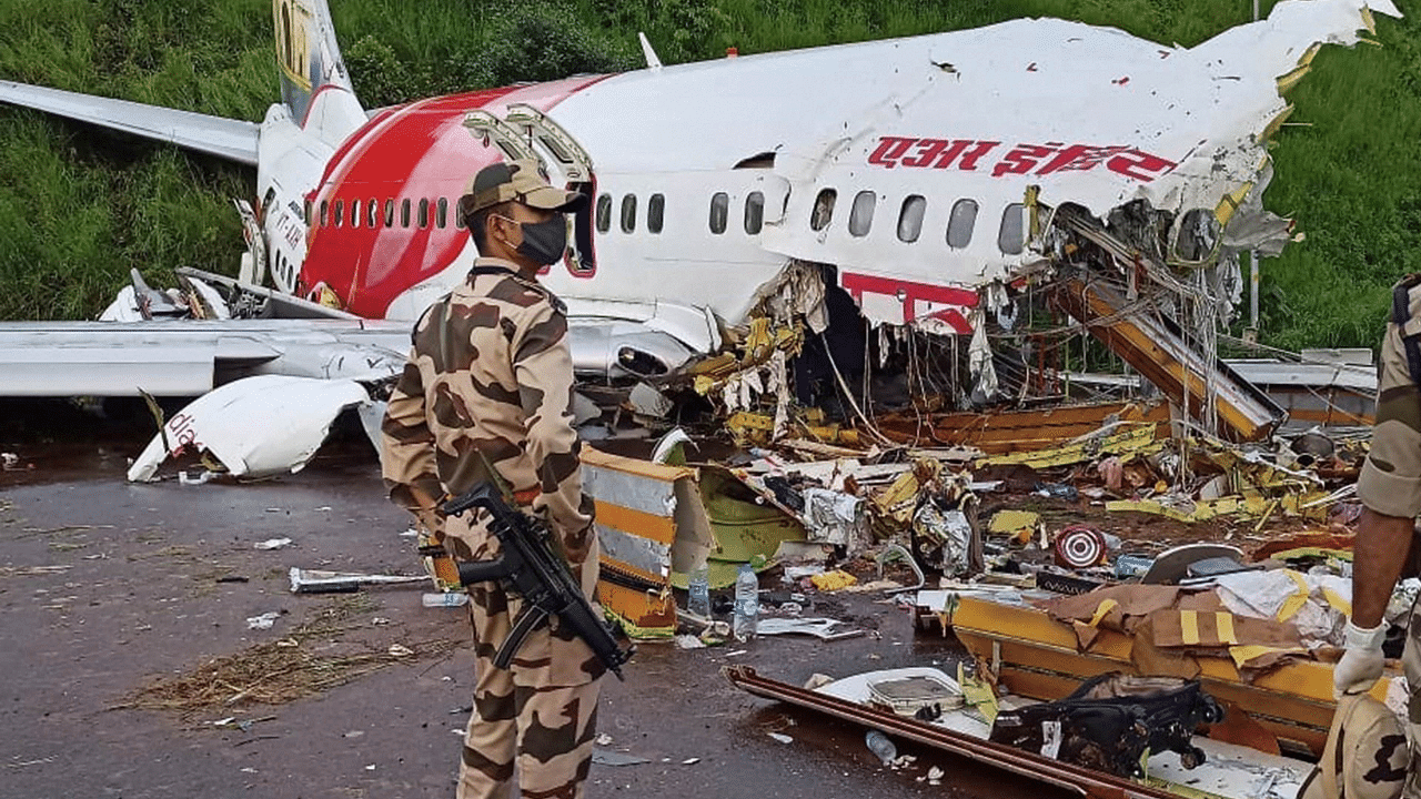 Mangled remains of an Air India Express flight, en route from Dubai, after it skidded off the runway while landing on Friday night. Credits: PTI Photo