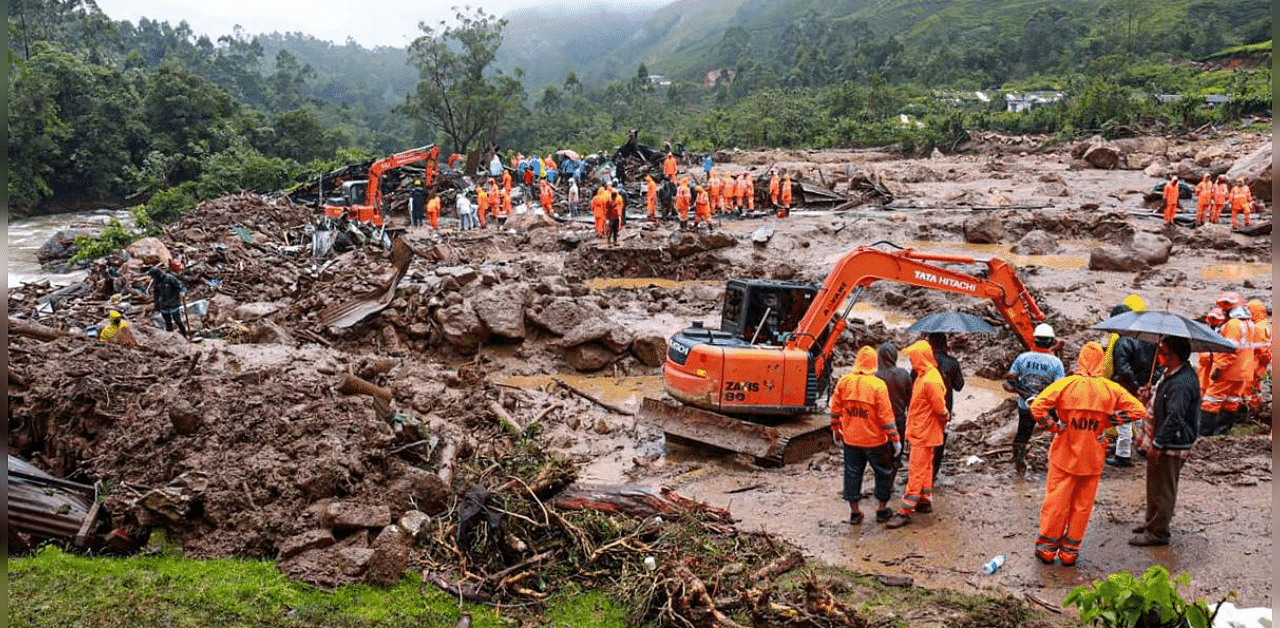 NDRF personnel carry out a rescue operation for survivors after a landslide following heavy rainfall, at Pettimudi in Idukki district. Credit: PTI Photo