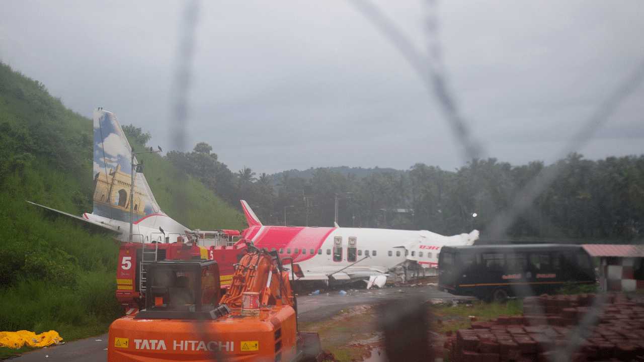 The Air India Express flight that skidded off a runway while landing at the airport in Kozhikode. Credits: AP Photo