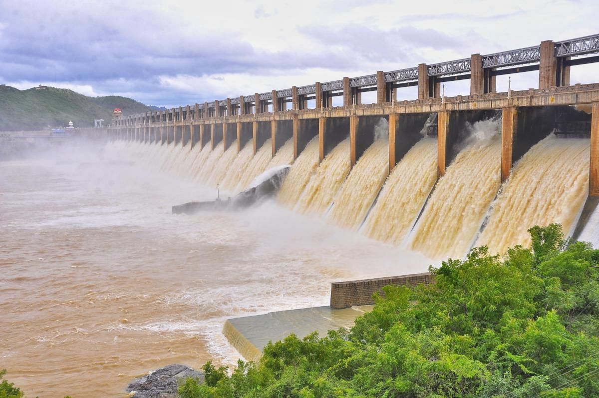 More than 1 lakh cusecs of water was let out from 28 crest gates of Tungabhadra reservoir near Hosapete on Friday. The current storage of the reservoir is 100.8 tmcft. DH PHOTO 