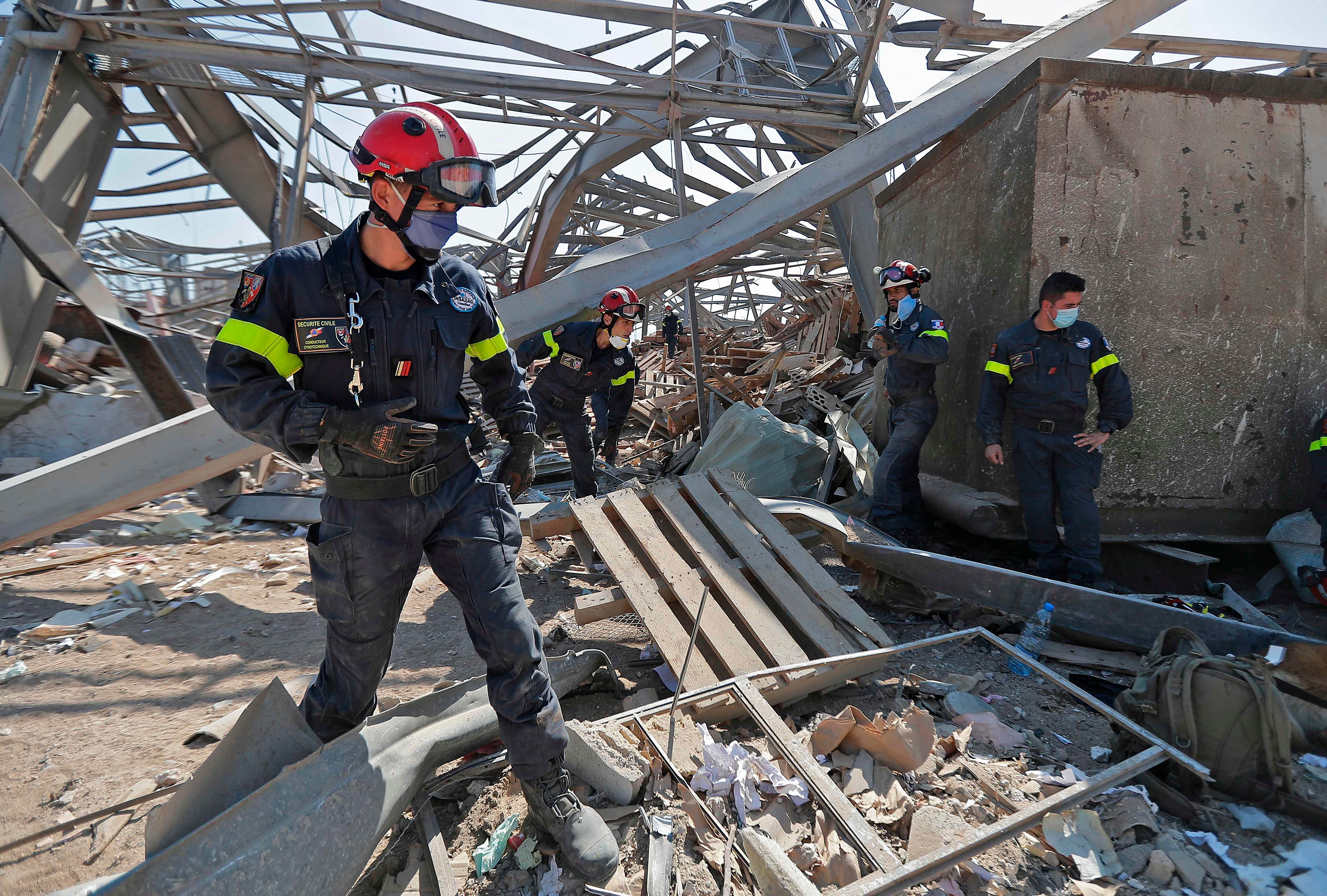 French rescue workers search through the rubble in the devastated Beirut port on August 7, 2020, three days after a massive blast there shook the Lebanese capital. Credit: AFP Photo