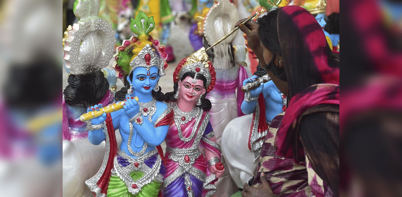  An artist gives final touches to Krishna idols ahead of Janmashtami festival. Credit: PTI