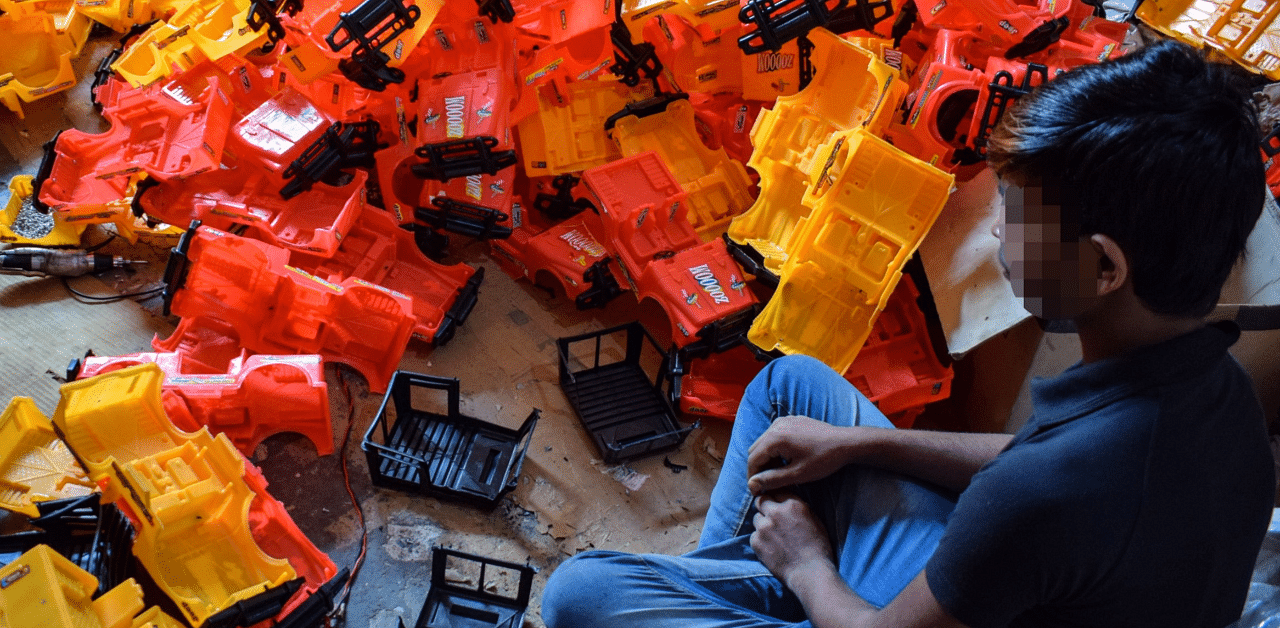 A child working at a toy factory. Credit: Bloomberg