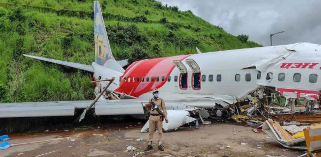 Mangled remains of an Air India Express flight en route from Dubai after it skidded off the runway while landing, at Karippur in Kozhikode. Credit: PTI Photo