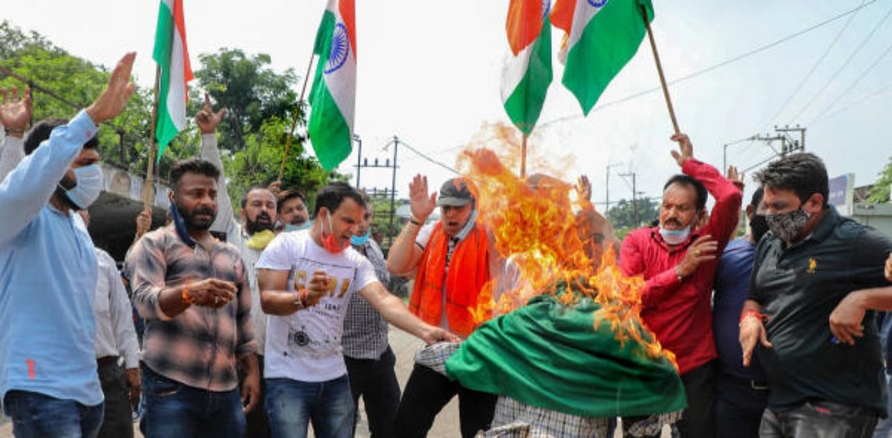 BJP activists stage a demonstration against the killing of party worker Abdul Hamid, who was attacked by unidentified gunmen yesterday, in Jammu, Monday, August 10, 2020. Credit: PTI Photo