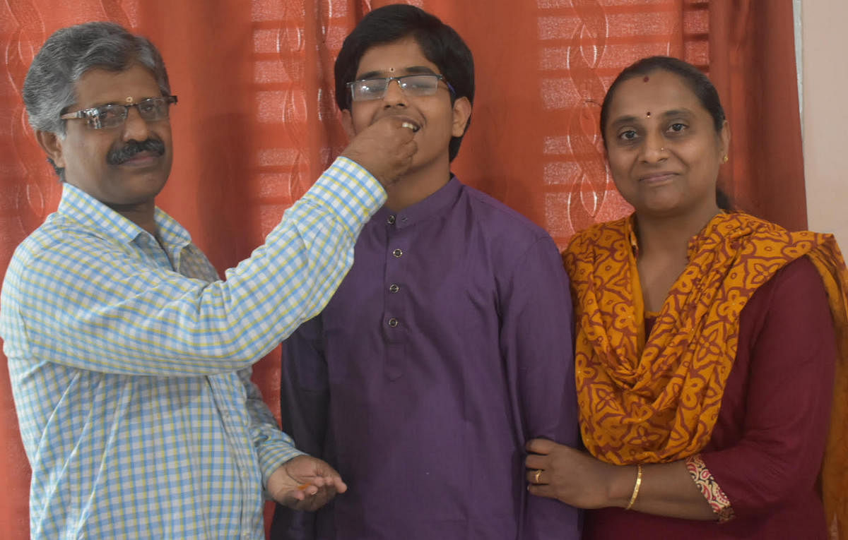 Harsha N Kaundinya with his parents H S Nagendra and Ashwini.