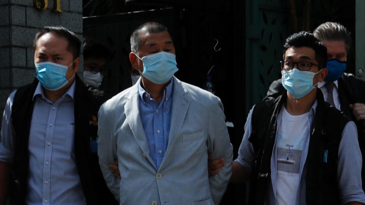 Media mogul Jimmy Lai Chee-ying, founder of Apple Daily (C) is detained by the national security unit in Hong Kong. Credit: Reuters