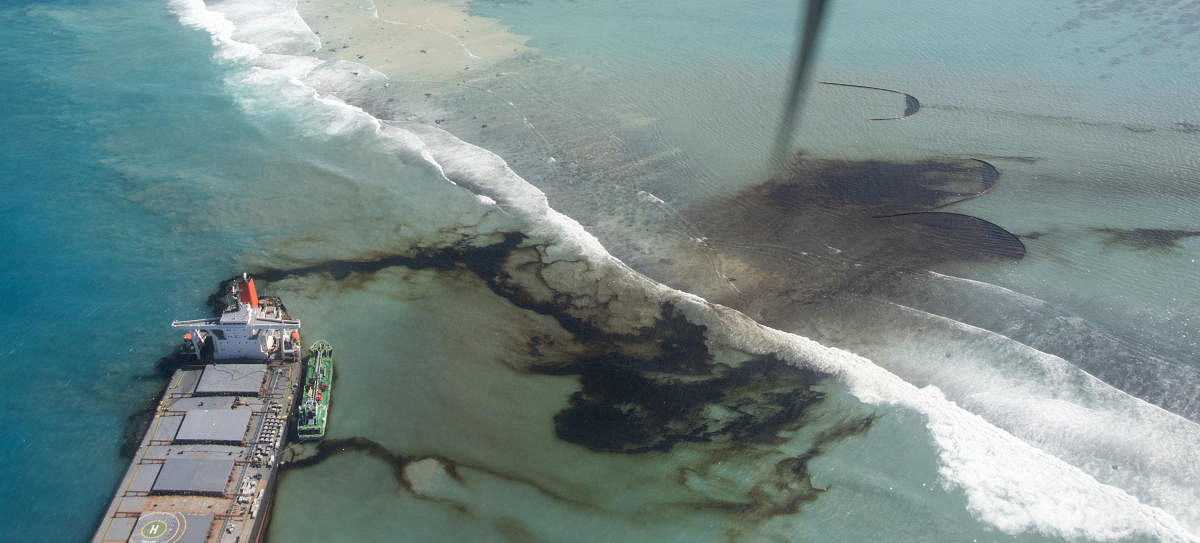 This photo provided by the French Army shows oil leaking from the MV Wakashio, a bulk carrier ship that ran aground off the southeast coast of Mauritius, Tuesday Aug.11, 2020. Thousands of students, environmental activists and residents of Mauritius were working around the clock trying to reduce the damage to the Indian Ocean island from an oil spill after a tanker ran aground on a coral reef. An estimated 1 ton of oil from the Japanese ship's cargo of 4 tons has already escaped into the sea, officials said. Credit: AP/PTI