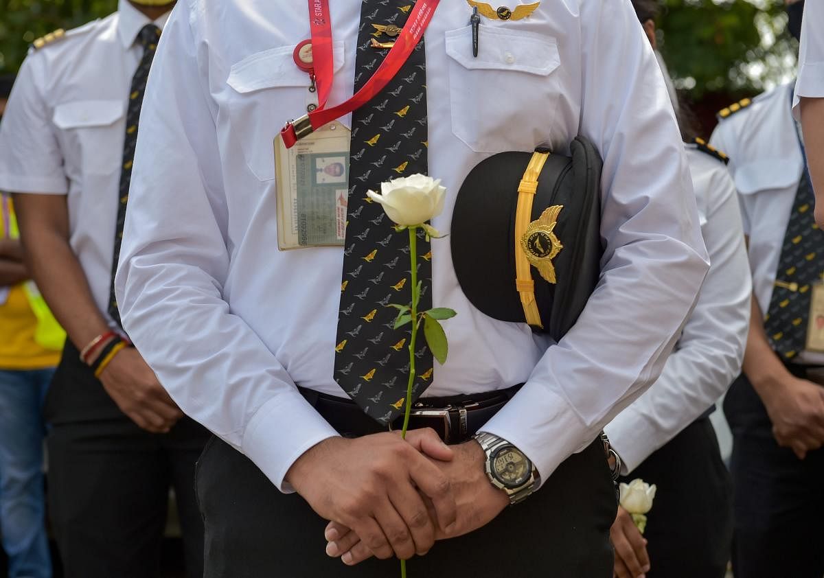 Mumbai: Air India staff pays homage to Captain Deepak Sathe during his funeral ceremony, in Mumbai, Sunday, Aug 9, 2020. Sathe died in the Air India Express flight crash after it overshot the runway while landing at Kozhikode airport, recently. (PTI Photo