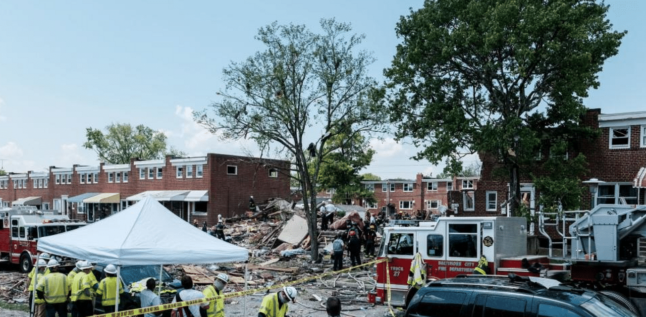 First responders search for survivors at the scene of an explosion on August 10, 2020 in Baltimore, Maryland. Credit: AFP Photo