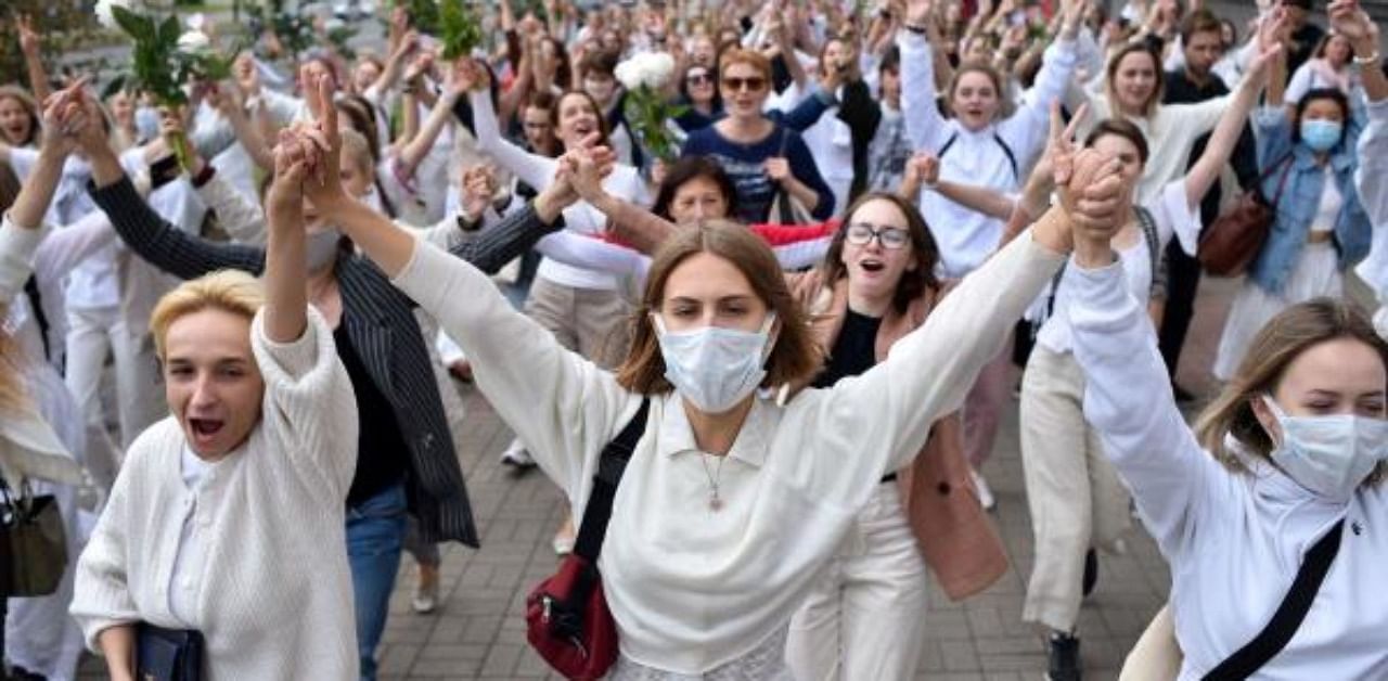 Women dressed in white clothes protest against police violence during recent rallies of opposition supporters, who accuse strongman Alexander Lukashenko of falsifying the polls in the presidential election, in Minsk. Credit: AFP Photo