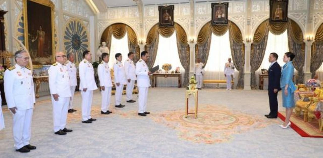 Thailand's Prime Minister Prayuth Chan-ocha center, and his 6 new ministers take their oath in front of Thailand's King Maha Vajiralongkorn and Queen Suthida in Dusit Palace, Bangkok. credit: AP/PTI Photo