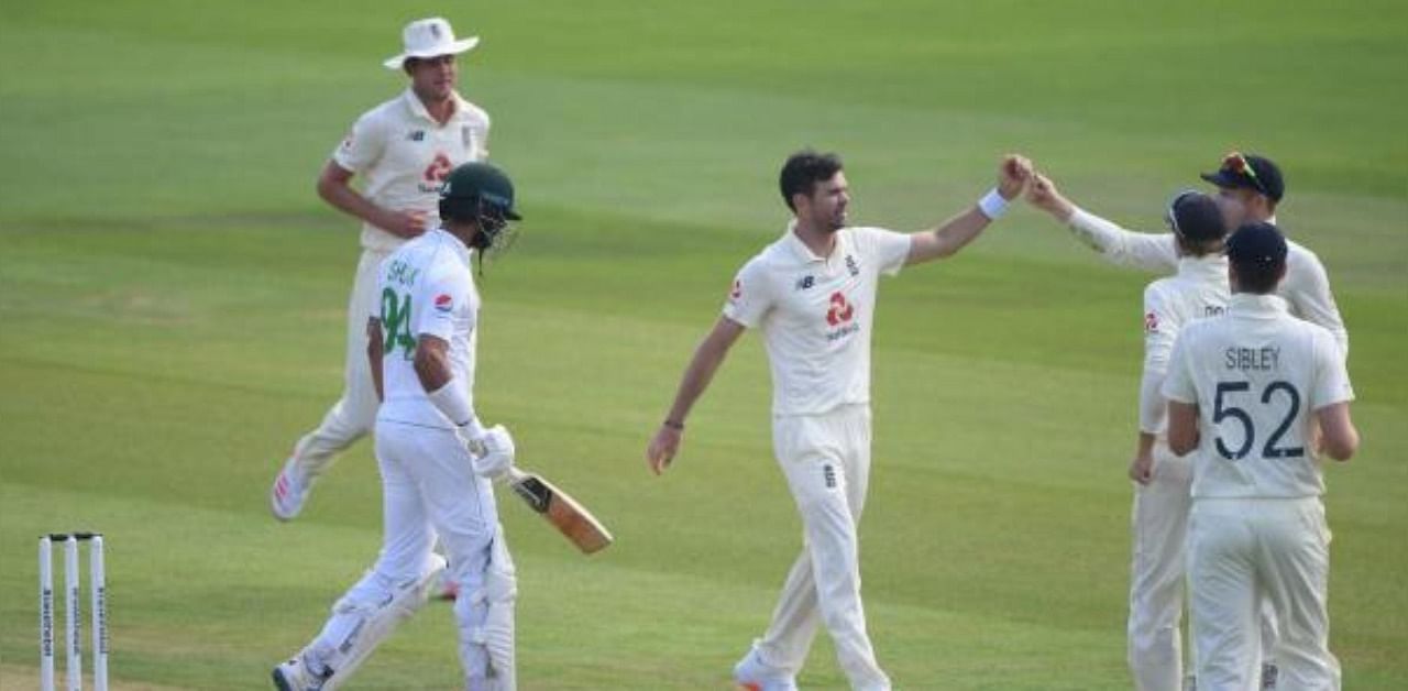 England's James Anderson celebrates taking the wicket of Pakistan's Shan Masood on the first day of the second Test cricket match between England and Pakistan. Credit: AFP