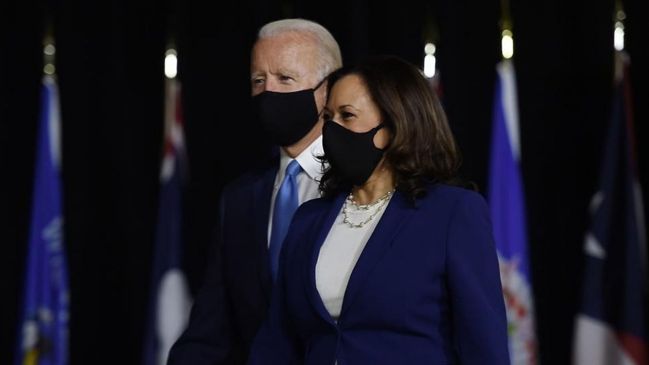 Democratic presidential nominee and former US Vice President Joe Biden (L) and vice presidential running mate, US Senator Kamala Harris, arrive to conduct their first press conference together in Wilmington, Delaware. Credit: AFP
