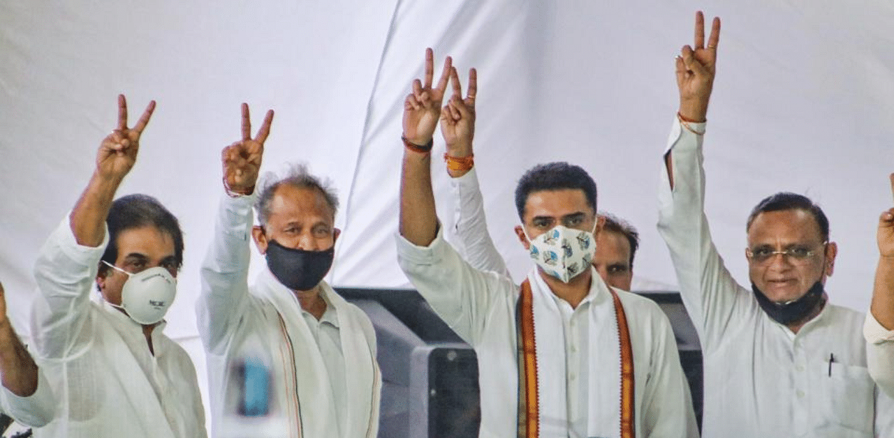 Rajasthan Chief Minister Ashok Gehlot along with senior Congress leaders Sachin Pilot, Avinash Pandey and others flashes victory signs during the party MLAs meeting, at CM residence in Jaipur, Thursday, Aug 13, 2020. Credit: PTI Photo