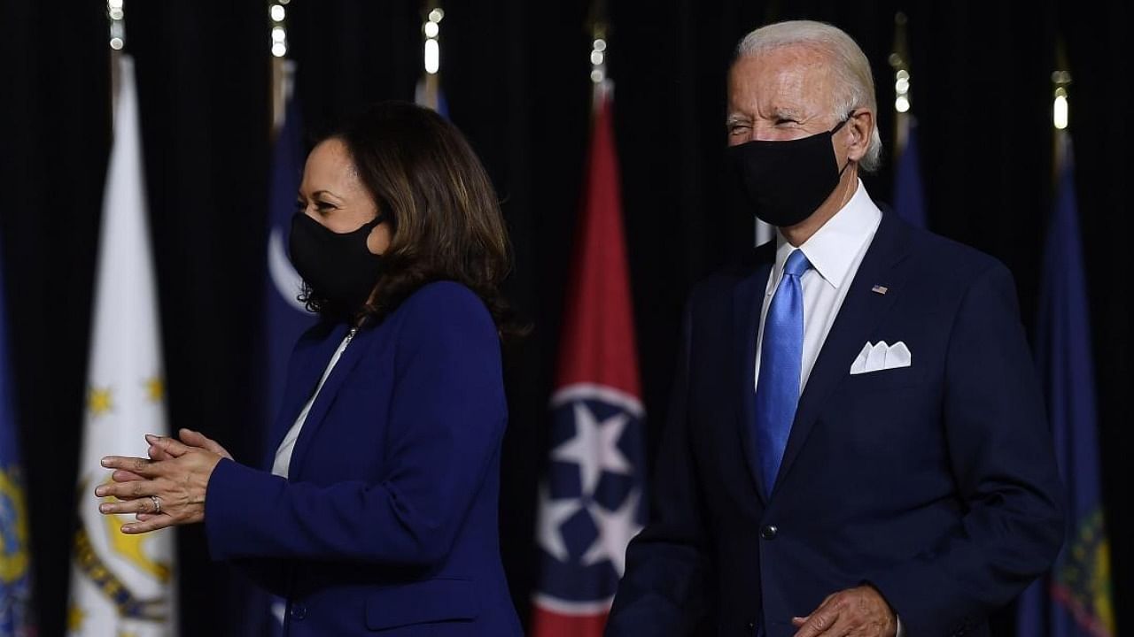 Democratic presidential nominee and former US Vice President Joe Biden (L) and vice presidential running mate, US Senator Kamala Harris, arrive to conduct their first press conference together in Wilmington, Delaware. Credit: AFP