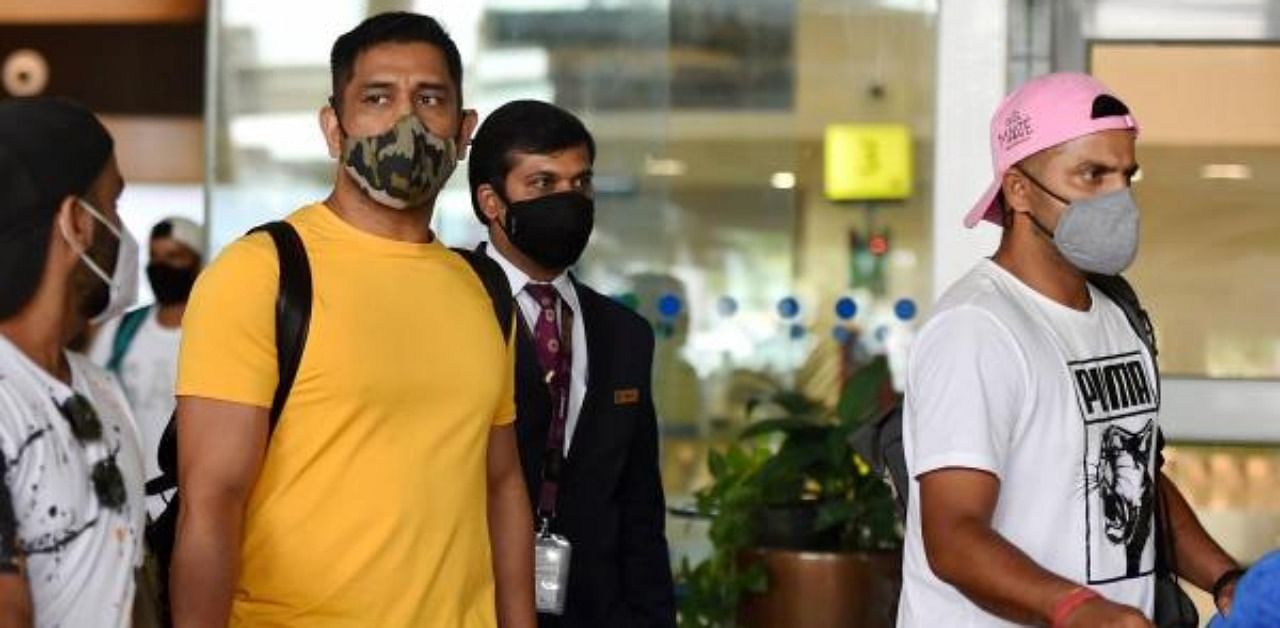 Chennai Super King's Skipper MS Dhoni along with his teammate Suresh Raina (R) arrives at Chennai Airport to participate in a week training session ahead of the IPL T20, in Chennai. Credit: PTI