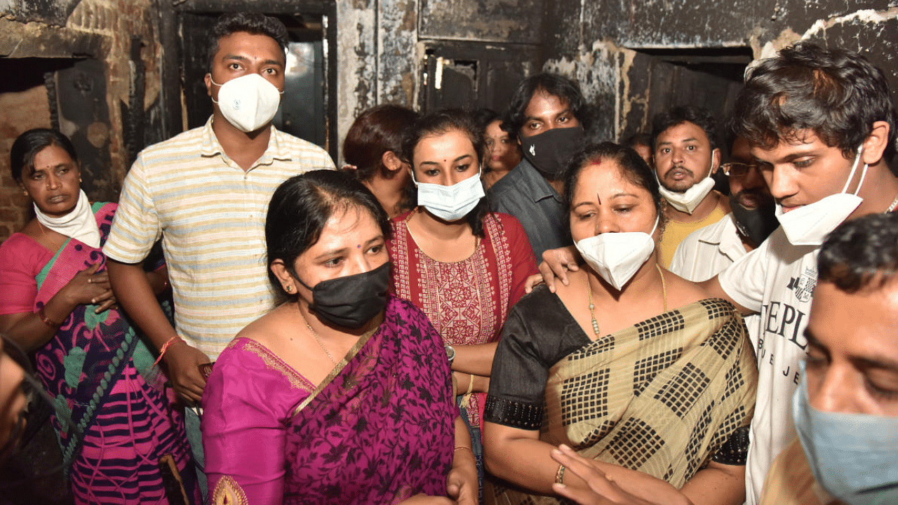 The MLA's family looks devastated on seeing their house completely destroyed. Credits: DH Photo