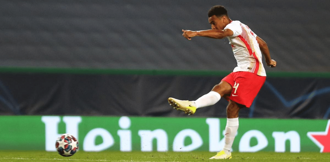 Leipzig's US midfielder Tyler Adams shoots to score his goal during the UEFA Champions League quarter-final football match between Leipzig and Atletico Madrid at the Jose Alvalade stadium in Lisbon. Credit: AFP Photo