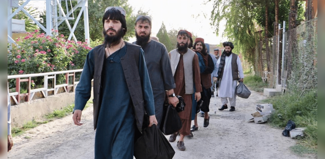 Newly freed Taliban prisoners walk at Pul-e-Charkhi prison, in Kabul, Afghanistan. Credit: Reuters Photo