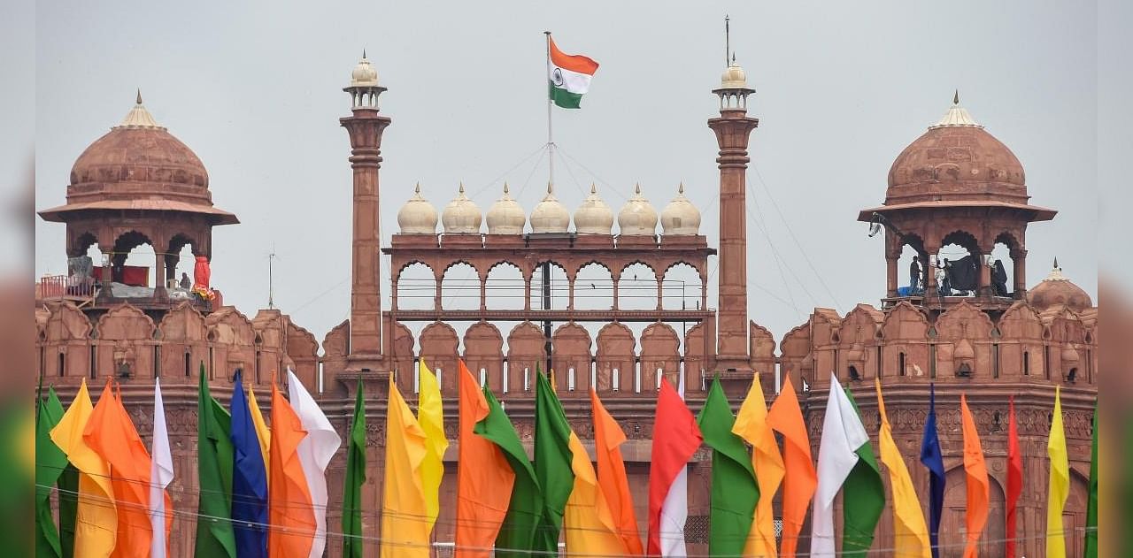 Indian national flag flutters atop the historic Red Fort on the eve of 74th Independence Day, in New Delhi, Friday, Aug 14, 2020. Credit: PTI Photo