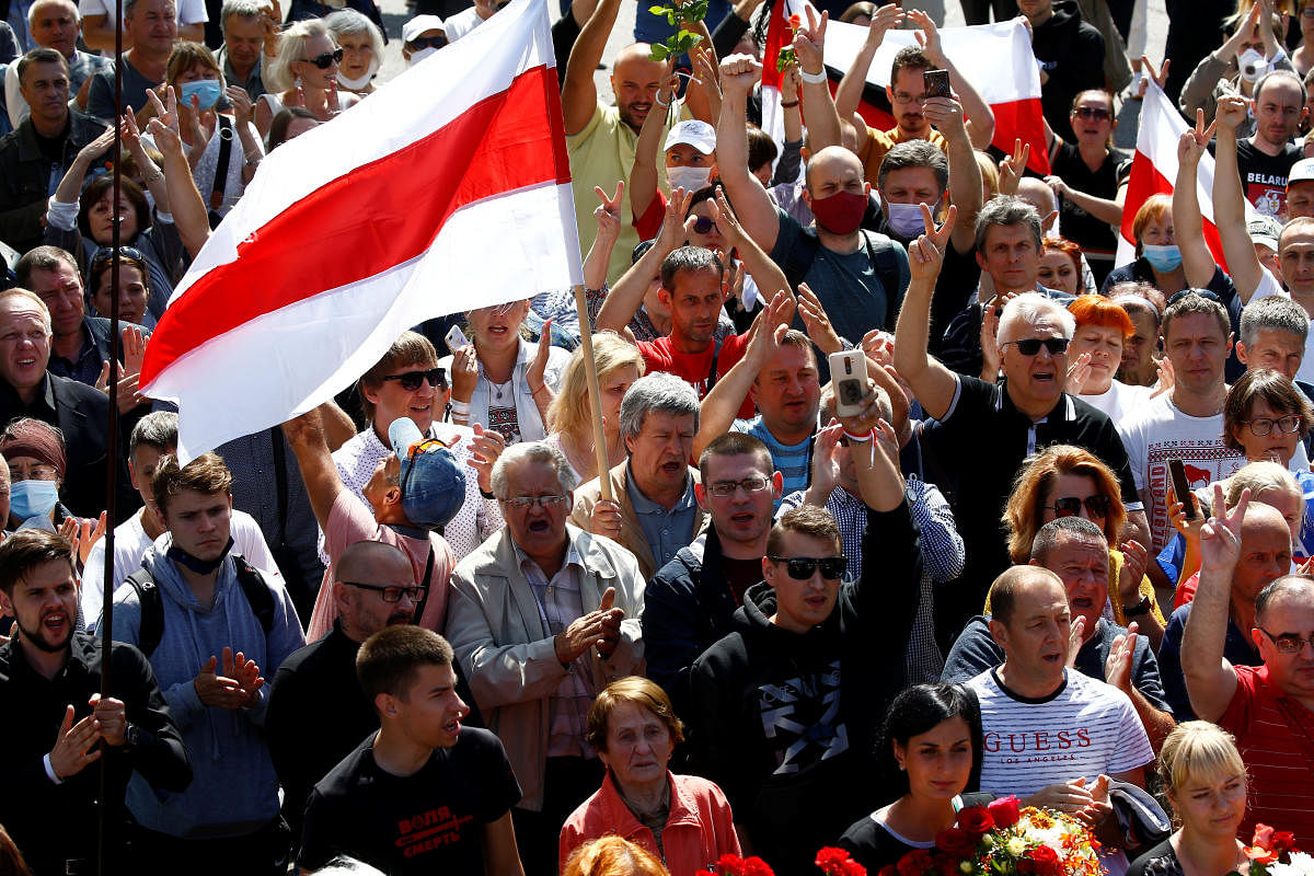 People attend a funeral ceremony for protester Alexander Taraykovskiy, who was killed during recent rallies against the presidential election results, in Minsk, Belarus August 15, 2020. Credit: Reuters Photo