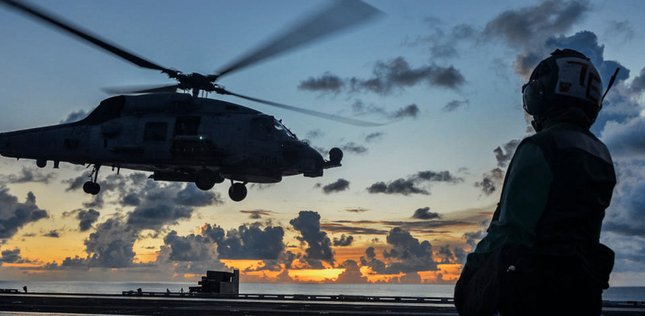 An MH-60R Sea Hawk helicopter launches during flight operations aboard the US Navy aircraft carrier USS Ronald Reagan in the South China Sea. Credit: Reuters Photo