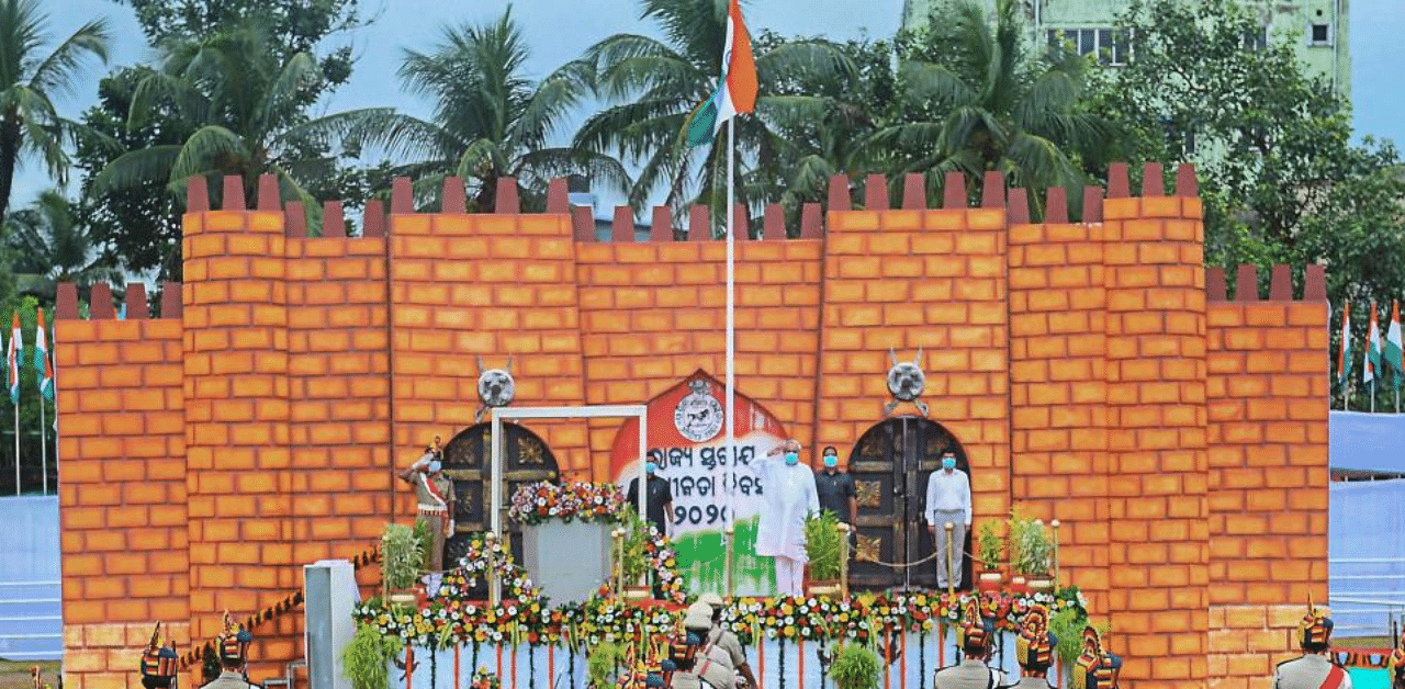 Odisha Chief Minister Naveen Patnaik salutes after hoisting the Tricolor during the 74th Independence Day celebration, at Exhibition Ground in Bhubaneswar. Credit: PTI Photo