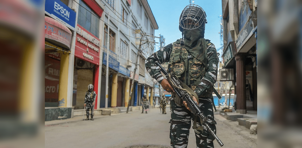 Srinagar: Women CRPF personnel stand guard on a street. Credit: PTI