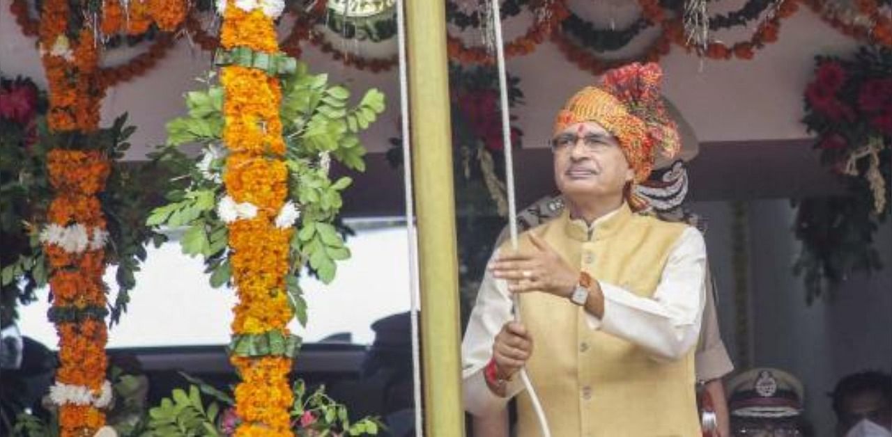 Madhya Pradesh Chief Minister Shivraj Singh Chouhan hoists the Tricolour during 74th Independence Day celebrations at Motilal Nehru Police Stadium in Bhopal. Credit: PTI Photo
