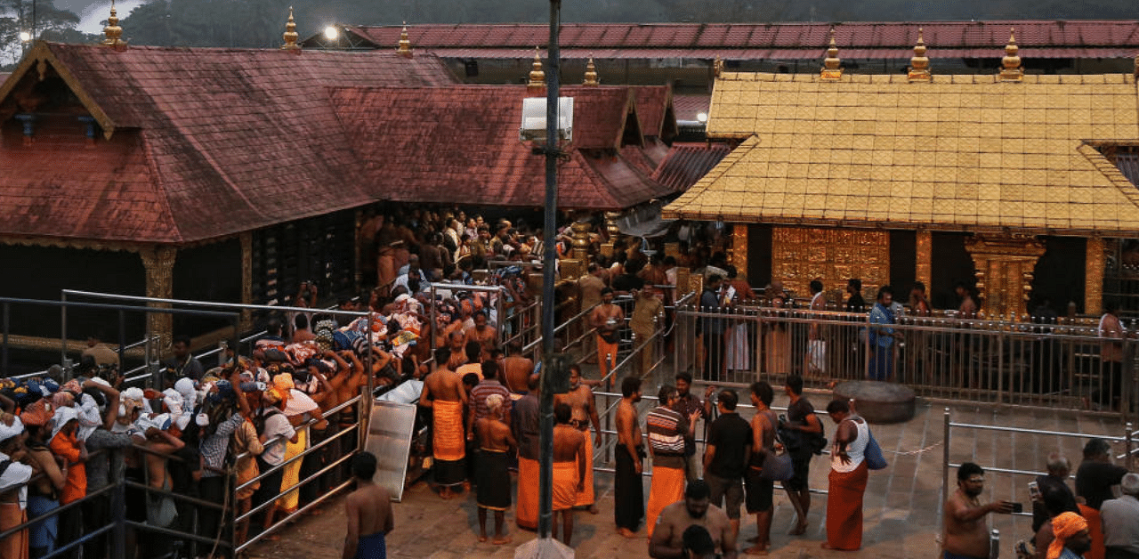 Hindu devotees wait in queues inside the premises of the Sabarimala temple in Pathanamthitta district in the southern state of Kerala, India, October 18, 2018. Credit: Reuters Photo