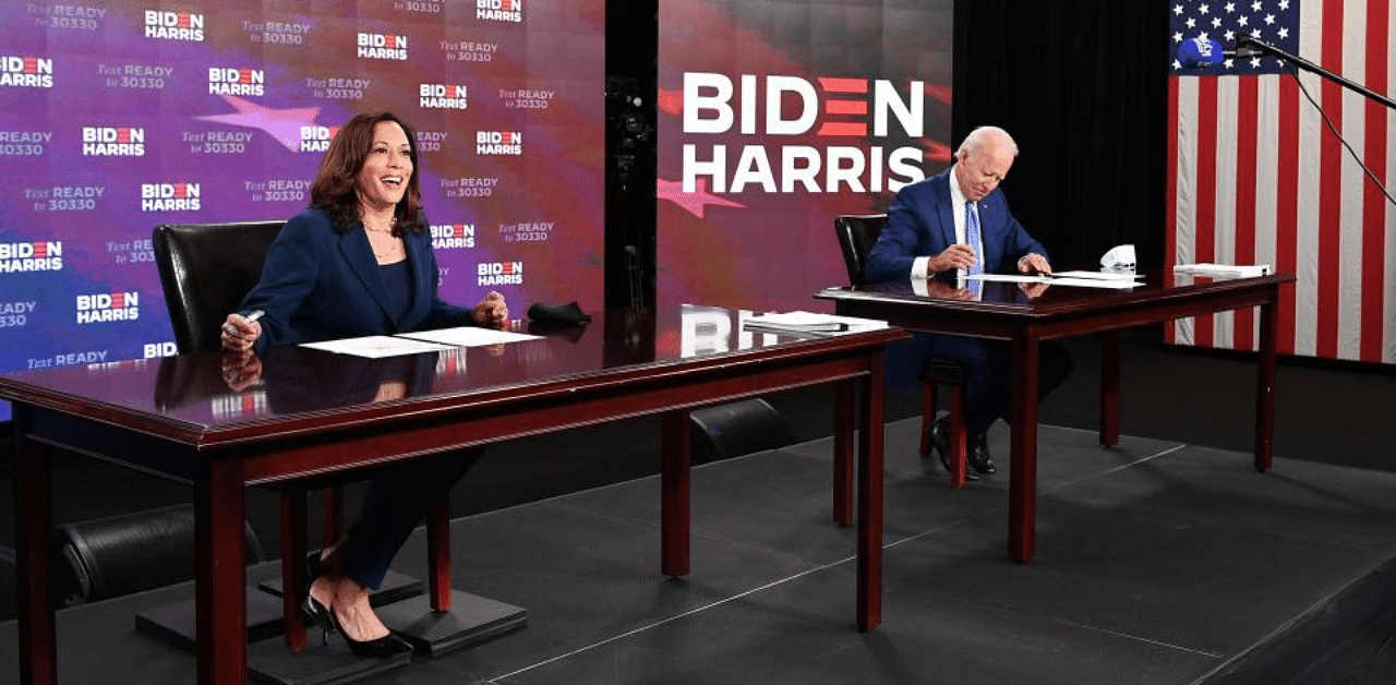 Democratic presidential nominee, former US Vice President Joe Biden, and Vice Presidential running mate, US Senator Kamala Harris, sign required documents for receiving the Democratic nomination. Credit: AFP Photo