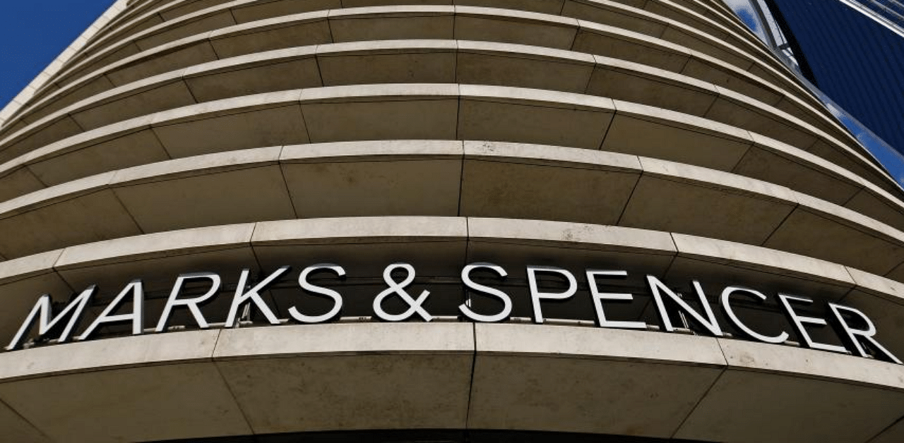 Logo above the entrance to a M&S (Marks and Spencer) store in central London. Credit: AFP Photo